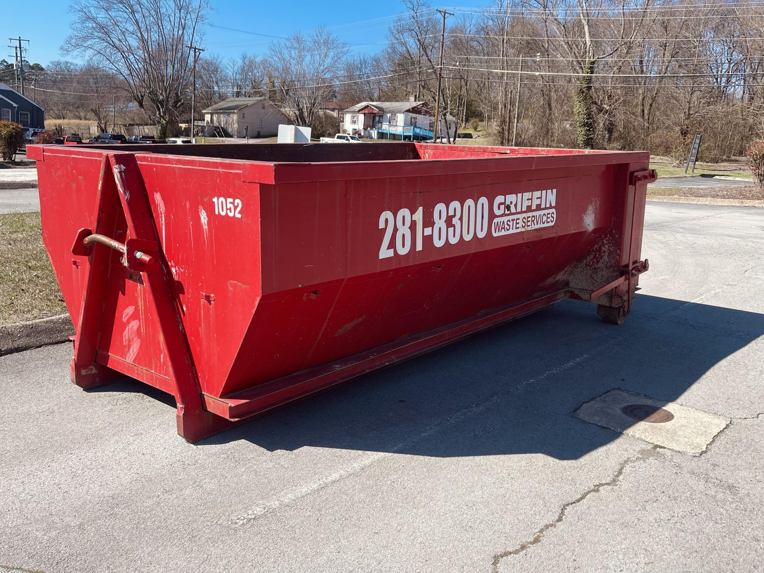 This scene emphasizes the importance of choosing the right dumpster size for efficient junk removal and cleanup in home renovations.  This dumpster fits perfectly in a parking space!